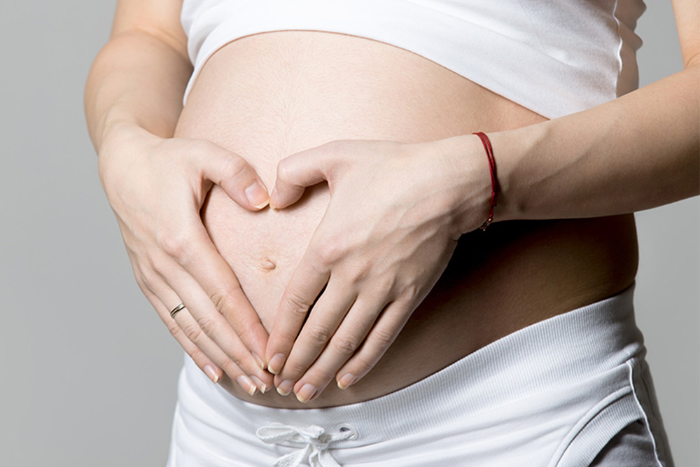 woman belly pregnant PGS surrogacy process